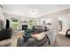 Bright living room with a cozy fireplace and comfortable seating arrangement at 306 Berlin Way, Morrisville, NC 27560