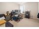 This home office provides a dedicated workspace with carpeted floors and natural light at 306 Berlin Way, Morrisville, NC 27560
