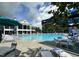 Resort-style community pool with ample seating and a clubhouse in the background on a sunny day at 306 Berlin Way, Morrisville, NC 27560