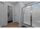 Bathroom showing a glass enclosed shower, two entry doors, and ceramic tile flooring at 315 Watchmen Ln, Cameron, NC 28326
