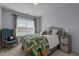 Bedroom features a large sunny window, Queen bed, and a decorative chair at 315 Watchmen Ln, Cameron, NC 28326