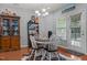Cozy dining area featuring a round table, modern chandelier, and charming decor at 315 Watchmen Ln, Cameron, NC 28326