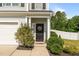 Inviting front entrance with a decorative wreath and manicured landscaping at 315 Watchmen Ln, Cameron, NC 28326