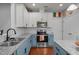 Eat-in kitchen features granite countertops, stainless steel appliances, and an island with bar seating at 315 Watchmen Ln, Cameron, NC 28326