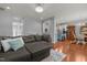 Open-concept living room flowing into the dining area and kitchen with hardwood floors at 315 Watchmen Ln, Cameron, NC 28326