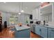 Open concept eat-in kitchen and living room featuring granite countertops and stainless steel refrigerator at 315 Watchmen Ln, Cameron, NC 28326