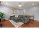 Cozy living room featuring a comfortable gray sectional sofa and hardwood floors at 315 Watchmen Ln, Cameron, NC 28326