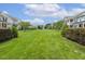 Expansive community green offers a picturesque view and enhances neighborhood appeal at 316 Levi Ln, Wake Forest, NC 27587