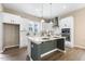 Stylish kitchen showcasing white cabinets, stainless appliances, and island seating at 316 Levi Ln, Wake Forest, NC 27587