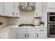 Close-up of kitchen features, showing modern appliances and tile backsplash at 316 Levi Ln, Wake Forest, NC 27587