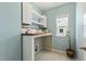 Laundry room featuring a butcher block countertop, built in cabinets, and natural light at 316 Levi Ln, Wake Forest, NC 27587