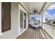 Enjoy the outdoors on this relaxing porch featuring a ceiling fan and a comfy daybed at 316 Levi Ln, Wake Forest, NC 27587