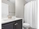 Bathroom featuring a dark vanity with marble countertops and a shower-tub combination at 33 E Ravano Dr, Clayton, NC 27527