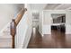 Foyer with wood floors, staircase, and views into the home at 33 E Ravano Dr, Clayton, NC 27527
