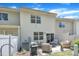A cozy backyard patio with outdoor seating, grill, and air conditioner at 342 Westgrove Ct, Durham, NC 27703