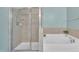Bathroom featuring a glass-enclosed shower and a soaking tub at 342 Westgrove Ct, Durham, NC 27703