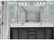 Bathroom with double sinks, vanity, a large mirror, and a separate shower and tub at 342 Westgrove Ct, Durham, NC 27703