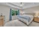 Comfortable bedroom with a plush bed, large window, and neutral decor at 342 Westgrove Ct, Durham, NC 27703