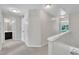Upstairs hallway with carpeted floors, multiple doors, and natural light at 342 Westgrove Ct, Durham, NC 27703