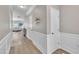 Well-lit hallway with fresh paint and modern trim that leads into the living area at 342 Westgrove Ct, Durham, NC 27703