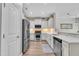 Modern kitchen featuring stainless steel appliances, white cabinets, and sleek countertops at 342 Westgrove Ct, Durham, NC 27703