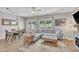 Bright living room with hardwood floors, a ceiling fan, and access to the outdoors at 342 Westgrove Ct, Durham, NC 27703