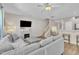 Open living area with cozy furniture, a fireplace, and a staircase at 342 Westgrove Ct, Durham, NC 27703