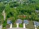 Beautiful neighborhood featuring manicured lawns, mature trees and a serene pond at 4105 Bankshire Ln, Raleigh, NC 27603