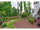 Landscaped backyard with pond view and privacy fence at 4105 Bankshire Ln, Raleigh, NC 27603