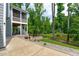 Backyard view of screened porch, landscaped yard, and pond at 4105 Bankshire Ln, Raleigh, NC 27603