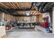 Unfinished basement with exposed ceiling and ductwork, features a workbench and various tools at 4105 Bankshire Ln, Raleigh, NC 27603