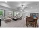 Spacious carpeted basement featuring a comfortable sectional sofa, dining table, and exercise equipment at 4105 Bankshire Ln, Raleigh, NC 27603