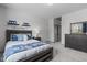Comfortable bedroom with blue accents, matching decor, and a full-sized bed at 4105 Bankshire Ln, Raleigh, NC 27603