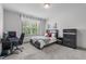Cozy bedroom setup with dark furniture, large window, and computer desk at 4105 Bankshire Ln, Raleigh, NC 27603