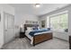 Bright bedroom with neutral colors, window seat, and a full-sized bed at 4105 Bankshire Ln, Raleigh, NC 27603