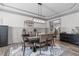 Dining room featuring wainscoting and a chandelier at 4105 Bankshire Ln, Raleigh, NC 27603