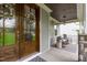Cozy front porch with rocking chairs, stylish decor, and a welcoming entrance at 4105 Bankshire Ln, Raleigh, NC 27603