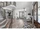 Spacious living area with staircase, open floorplan, elegant decor, and wood floors at 4105 Bankshire Ln, Raleigh, NC 27603