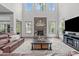 Bright living room with high ceilings, stone fireplace, and comfortable seating at 4105 Bankshire Ln, Raleigh, NC 27603