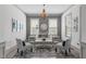 Living room with accent rug, stylish chairs, and large windows at 4105 Bankshire Ln, Raleigh, NC 27603
