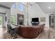 Open-concept living room with vaulted ceilings, stone fireplace, and ample seating at 4105 Bankshire Ln, Raleigh, NC 27603