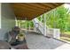 View of patio area under screened porch, with outdoor grill at 4105 Bankshire Ln, Raleigh, NC 27603