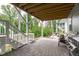Patio area underneath screened porch with view of yard at 4105 Bankshire Ln, Raleigh, NC 27603