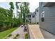 Stone patio with outdoor seating, and view of backyard at 4105 Bankshire Ln, Raleigh, NC 27603