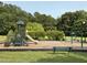 Community playground area with slide, swings, and seating at 4105 Bankshire Ln, Raleigh, NC 27603