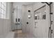 Walk-in shower featuring multi-head shower system and a view into the rest of the bathroom at 4105 Bankshire Ln, Raleigh, NC 27603