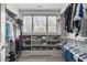 Spacious walk-in closet with custom shelving, storage, and a window for natural light at 4105 Bankshire Ln, Raleigh, NC 27603