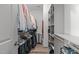 Walk-in closet featuring custom shelving and storage for shoes and hanging clothes at 4105 Bankshire Ln, Raleigh, NC 27603