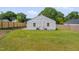 Back exterior view featuring a large green yard and a newly-installed wooden fence at 414 Craven St, Durham, NC 27704