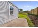 Side view of the house featuring backyard with a newly-installed wooden fence at 414 Craven St, Durham, NC 27704